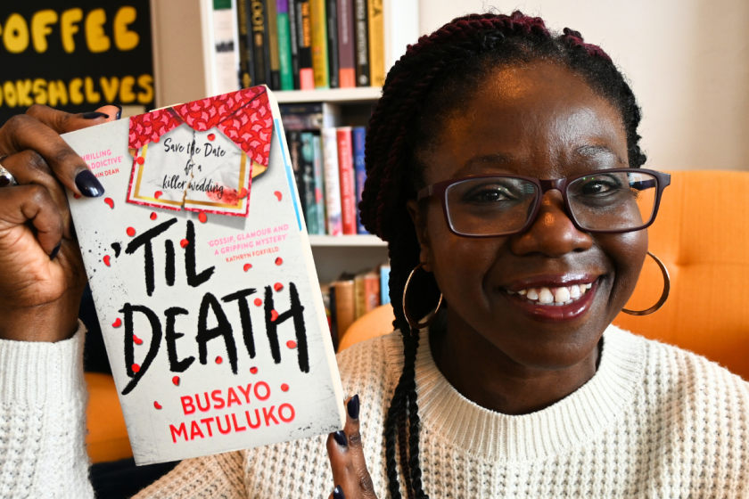 Shade holds copy of Til Death by Busayo Matuluko