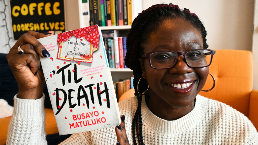 Shade holds copy of Til Death by Busayo Matuluko